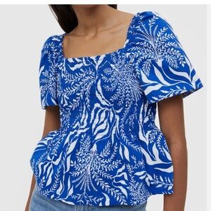 43.    H&M Smocked Blue and White Women's Top(Pit to pit 20” Length 21”)
